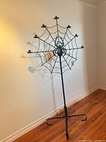 Full view of metal spider-web floor candelabra