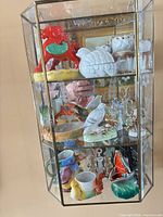 All shelves showing assorted ceramic and porcelain figurines