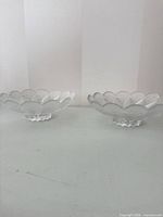 Both clear glass serving bowls side by side