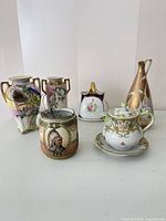 Group view of all seven Nippon porcelain pieces