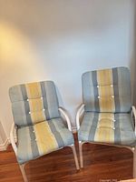 Front view of both chairs showing cushions and metal frames