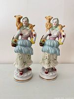 Full view of both matching figurines front on pedestal bases