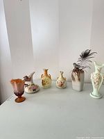 Group shot of six assorted vases on tabletop