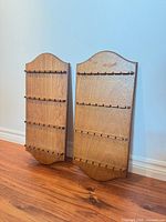 Front view of both wooden spoon racks standing side by side