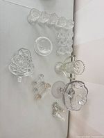 Full lot overview showing egg cups, dishes, vase, compote, knife rests, shakers