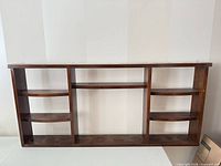 front view of entire wood display shelf