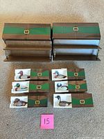 All six boxed duck figurines and two shelves displayed