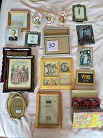 Overhead view showing all picture frames and two photo albums laid out on a surface