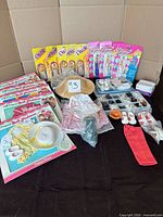 Overview of lot with carded Dazzle dolls, My Friend outfits, hats, shoe organizer and accessories