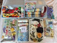 Organizers with embroidery threads, trims, flowers