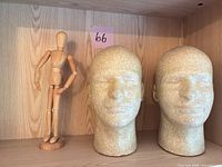 Two foam head forms and wooden artist mannequin