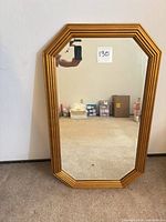 Front view of octagonal gold framed mirror