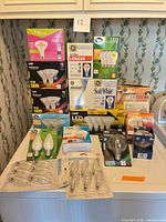 Overall shot showing all sealed light-bulb packages on a surface