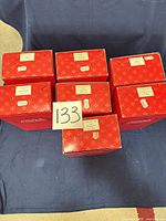 Six red presentation boxes top view