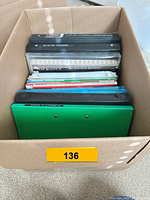 Top view of box showing binders and stacked publications