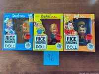 Front view of three sealed Kellogg's Snap, Crackle, Pop Rice Krispies dolls in original boxes
