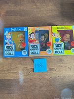 Front view of three boxed dolls Snap, Pop, Crackle