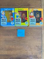 Front view of three sealed Kellogg's Snap, Crackle, Pop Rice Krispies doll boxes