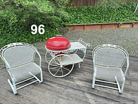 Overall lot view showing grill cart and two chairs outdoors