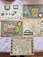 All five vintage style map prints laid out on table
