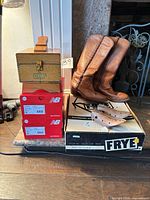 Group shot showing Frye boots, New Balance boxes, Griffin kit, shoe trees