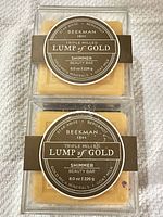 Front view of two sealed Beekman 1802 Lump of Gold Shimmer bar soaps showing labels and packaging