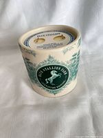 Ceramic candle showing horse design and branding
