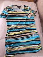Front view of striped Dana Buchman blouse with tags attached