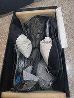 Shoes in original box with tissue and inserts visible