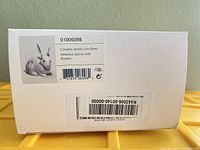 Lladró box label showing model 01006098 Attentive Bunny with Flowers