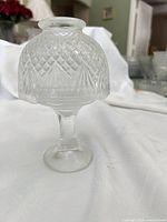 Clear pressed glass stemmed votive candle holder with diamond pattern globe shade