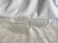 Two Princess House oval fluted crystal bowls showing overall form and spouts