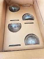 Cardboard insert holding spaces for coupe glasses