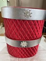 Stacked red quilted boxes showing quilt pattern, silver lid band and rhinestone snowflake