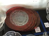 Stack of four ruby flash Kings Crown dinner plates showing clear centers and red rims