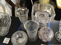 Group view of all five pressed glass pieces within lot