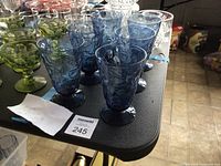 Six blue Bryce El Rancho water goblets on table