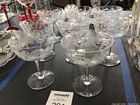 Group view of all eight thistle-cut coupe glasses