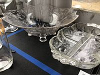 Flared footed bowl beside divided serving dish