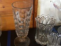 Tall footed goblet and cylindrical scalloped-rim vase