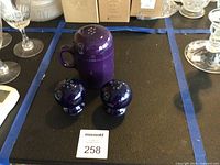 Front view of three Fiesta shakers showing shapes and colors