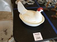 Side view of assembled milk glass hen on nest covered dish