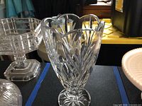 Front view of clear cut crystal vase showing pattern and scalloped rim