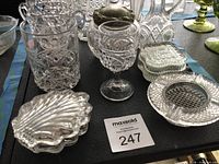 Group view of various pressed glass pieces on table