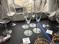 Group of four identical champagne flutes on tabletop