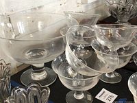 Large and small clear crystal pedestal bowls grouped together