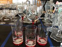 Front view showing four tumblers and three wine glasses with Winterberry pattern