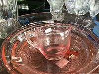 Stack showing creamer nested inside bowl and platter