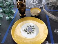 Blueberry dinner plate, Black Gold vase, teacup grouped