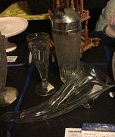 Cornucopia horn, bud vase, cocktail shaker grouped